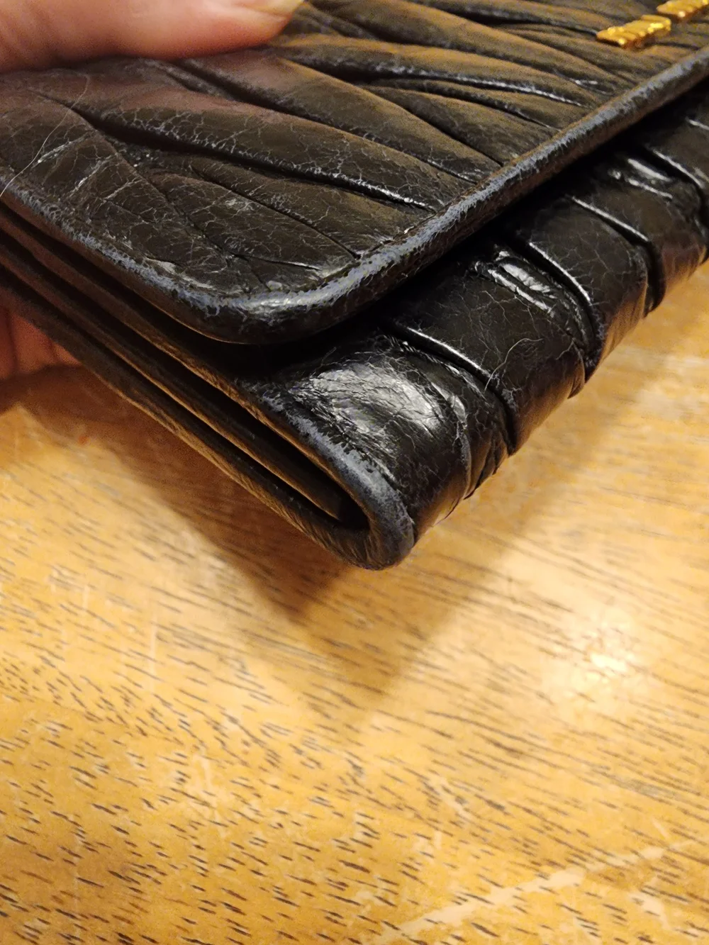 black quilted leather Miu Miu Matelassé long bifold wallet gold-tone Logo